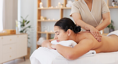 Buy stock photo Woman, spa bed and hands for back massage, care and professional treatment for muscle, stress or wellness. Girl, masseuse and holiday for physical therapy, spine or recovery at luxury resort for body
