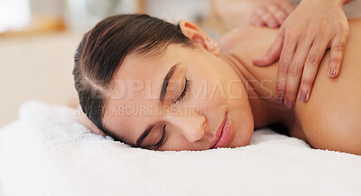 Health, relax and woman getting back massage at luxury spa lying on table with smile and massage therapist hands on back. Wellness, body care and physiotherapy service at beauty salon for happy women
