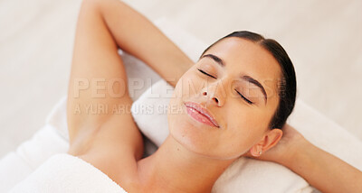Buy stock photo Spa, wellness and woman, calm and happy, peaceful after massage, massage therapy for body health and zen. Young person satisfied, lying down and carefree with peace and serene, stress relief.