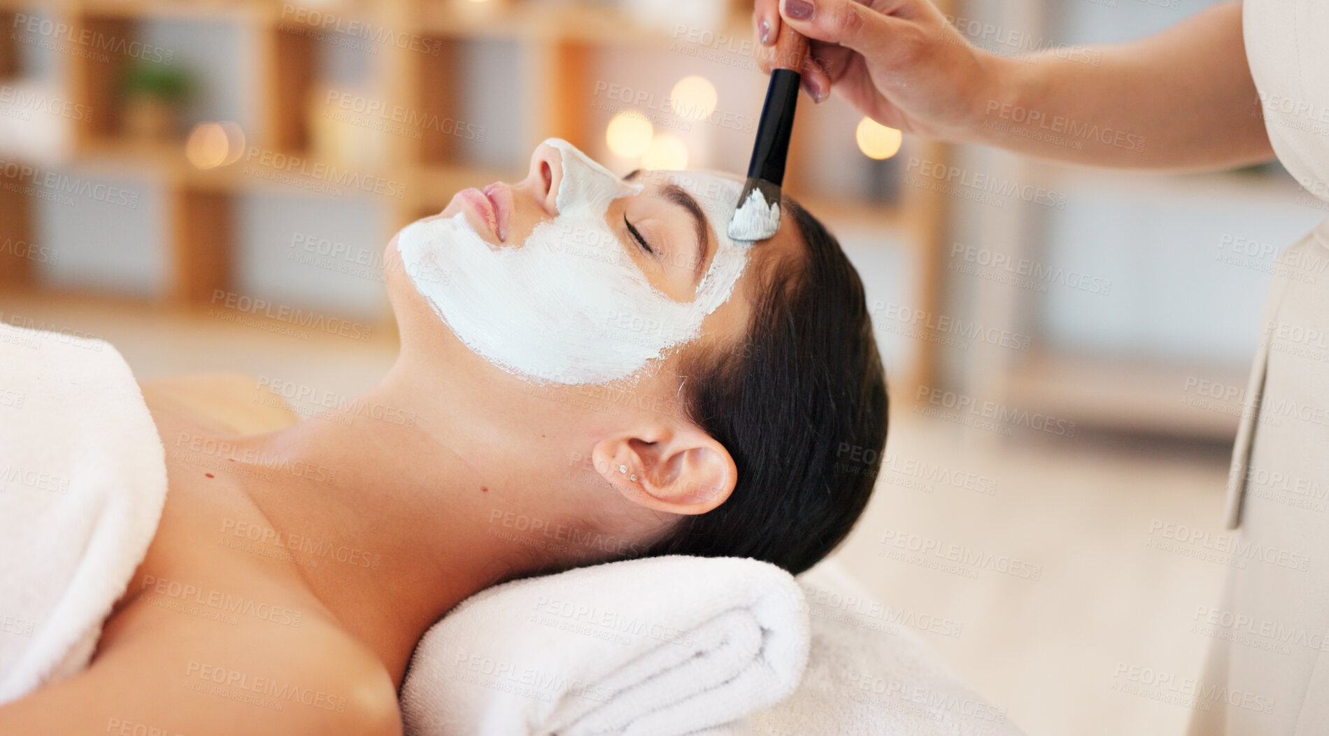 Buy stock photo Skincare, facial and woman in spa for luxury treatment, anti aging detox and wellness with masseuse. Resort salon, beauty and face of person with clay mask for health, cosmetics and holistic care