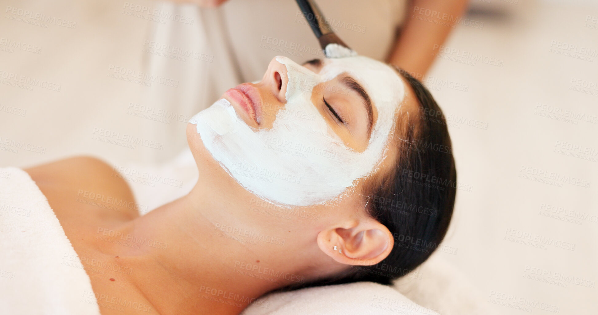 Buy stock photo Wellness, skincare and woman with face mask, luxury and spa on vacation, relax and treatment for acne. Facial, person and lady on a table, cosmetics and grooming with health, vacation and resort
