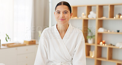 Buy stock photo Face, portrait and woman at spa for skincare, luxury massage and wellness on a bed at a hotel. Happy, smile and beauty of a young girl at a salon to relax for peace and calm during cosmetic therapy