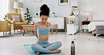 Fitness, yoga or meditation stretching woman for workout in the living room of her house. Girl with chakra focus, mindset or balance while training, exercise or health with zen pilates for wellness.