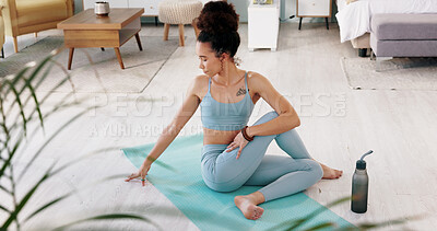 Fitness, yoga or meditation stretching woman for workout in the living room of her house. Girl with chakra focus, mindset or balance while training, exercise or health with zen pilates for wellness.