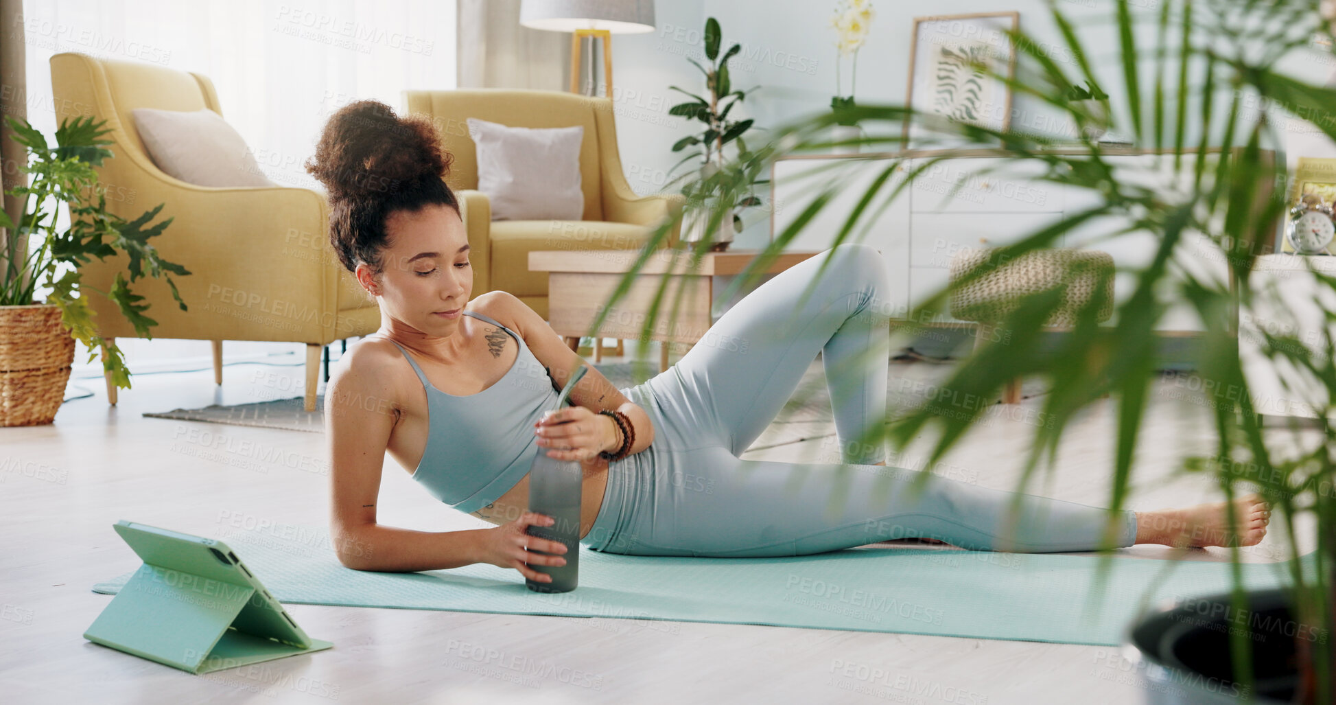 Buy stock photo Woman, fitness and yoga in relax or drinking water for break, rest or hydration after zen workout at home. Calm and thirsty female person or yogi with mineral liquid for sustainability or exercise