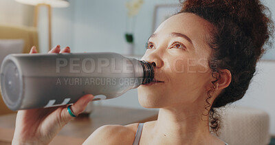 Buy stock photo Woman, fitness and drinking water in yoga, hydration or zen workout in living room at home. Face of female person and mineral liquid or bottle in natural nutrition, diet or sustainability in exercise