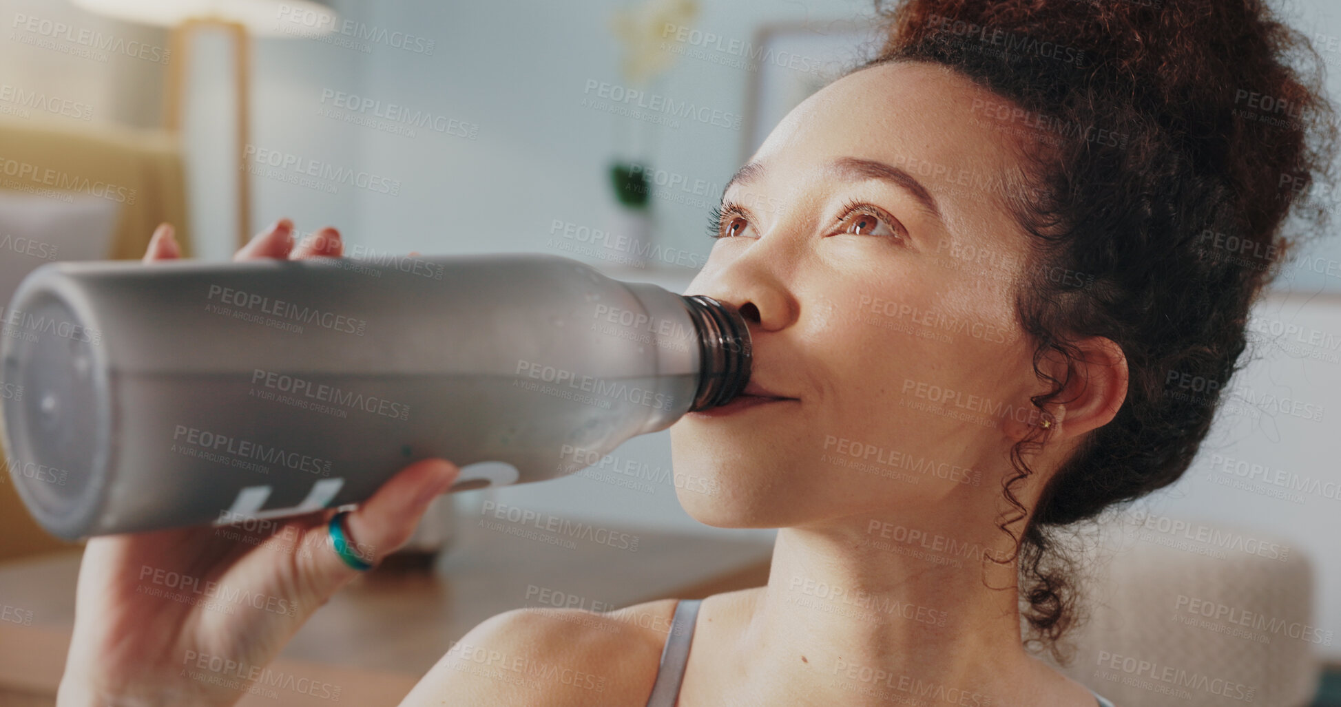 Buy stock photo Woman, fitness and drinking water in yoga, hydration or zen workout in living room at home. Face of female person and mineral liquid or bottle in natural nutrition, diet or sustainability in exercise