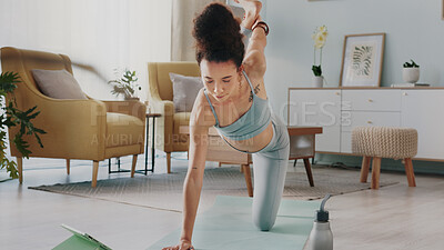 Buy stock photo Yoga, tablet and woman with online video for stretching exercise in the living room of her house. Girl with balance during fitness workout on the internet with tech in the lounge of her home