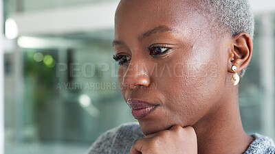Thinking, serious and black business woman sitting in an office planning a creative project with innovative ideas in an office. Black entrepreneur looking thoughtful working as marketing manager