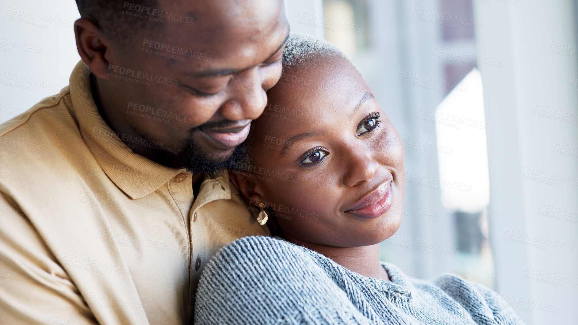 Buy stock photo Happy, morning and couple hug by window in home for bonding, commitment and relax together. Marriage, romance and black man and woman embrace for healthy relationship, love and happiness in apartment