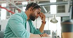 Headache, tired and burnout business man, working on laptop in office with stress, anxiety and burnout. Fatigue, depression and mental health risk of black man employee headache, angry or frustrated