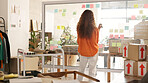 Planning, logistics and shipping with a black woman delivery worker writing on a glass board in her office. Marketing, supply chain and ecommerce with a female employee at work on stock strategy