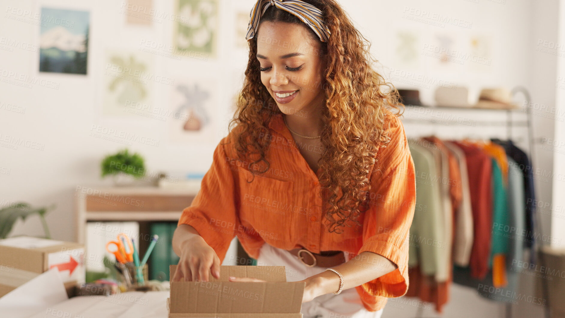 Buy stock photo Delivery, online order and woman in fashion on laptop while working at a boutique. Young, happy and African designer shipping stock of clothes in boxes and pc for service at a small business