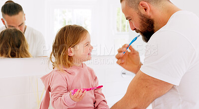Father, learning and teaching girl to brush teeth with toothbrush, dental hygiene and gum healthcare. Man, daughter and laughing in bathroom, healthy mouth or wellness with support for cleaning tooth