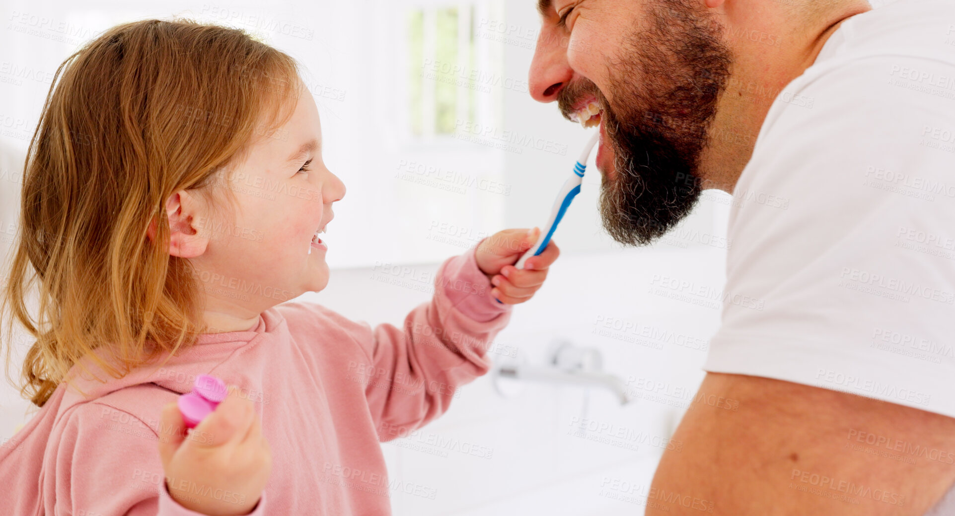 Buy stock photo Dental, family and brushing teeth by father and girl child in a bathroom happy, play and bond at home. Oral care, cleaning and playful kid with parent, mouth and toothbrush, learning or hygiene fun