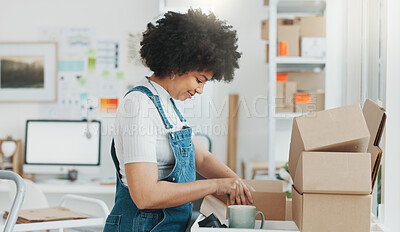 Startup, delivery and shipping in boxes for online shopping business. Businesswoman packing products from online business in a box to ship to clients and buyers. Black woman working in the office