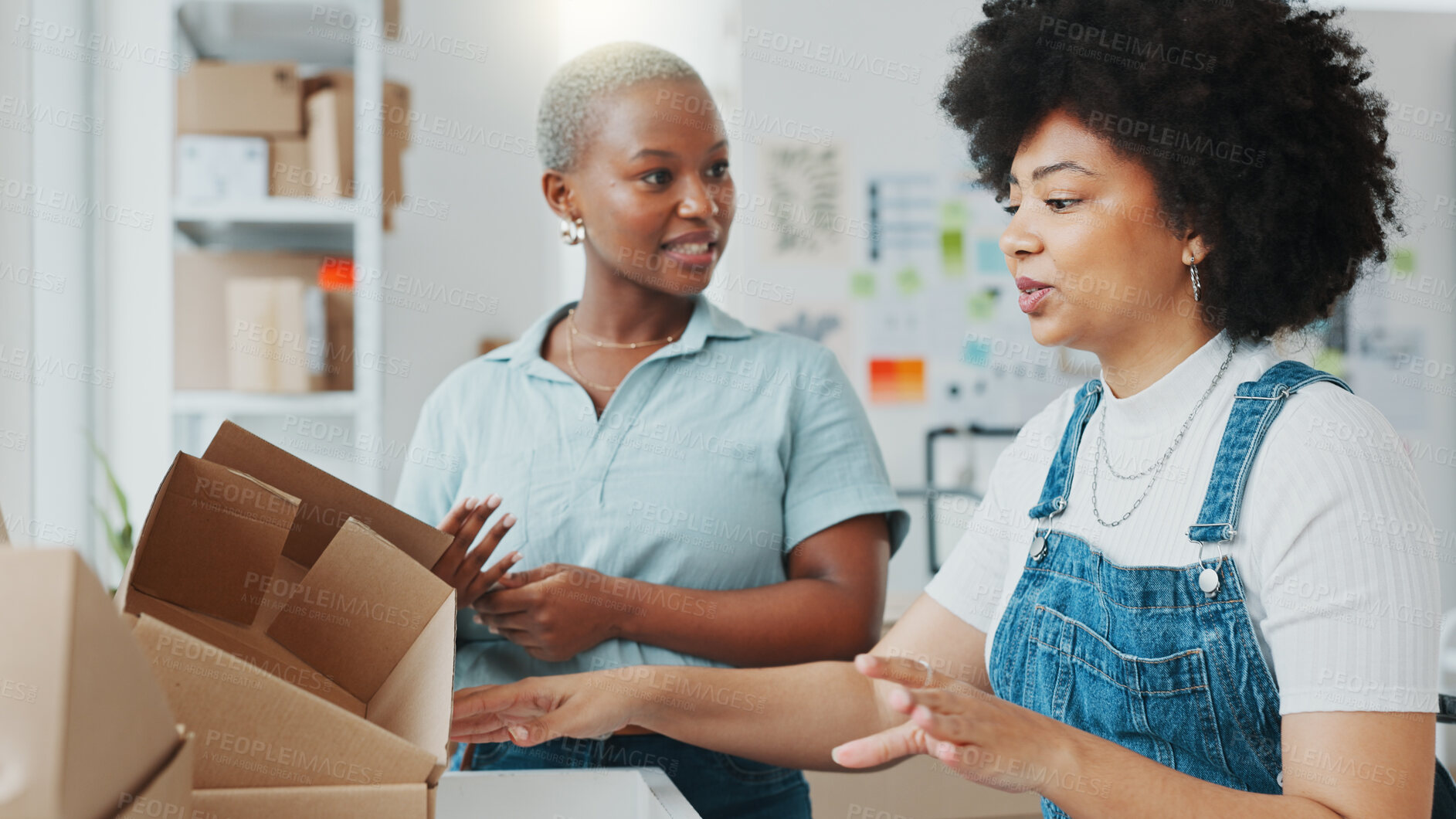 Buy stock photo Woman, partnership and talking with boxes, startup and logistics with planning schedule for delivery job. Black business owner, package and discussion with teamwork, brainstorming and supply chain