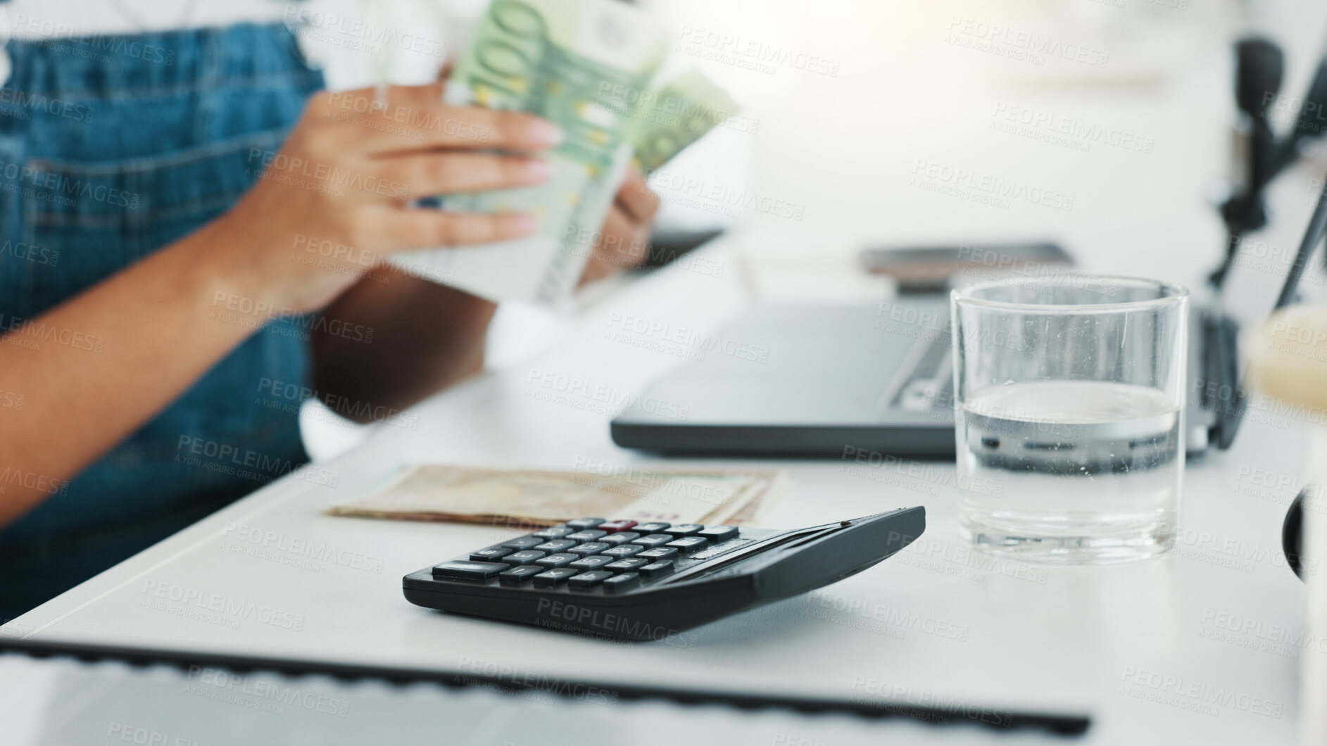 Buy stock photo Hand, money and calculator for budget with a person closeup at their desk in a home for accounting. Finance, investment and small business startup with an entrepreneur counting assets or savings