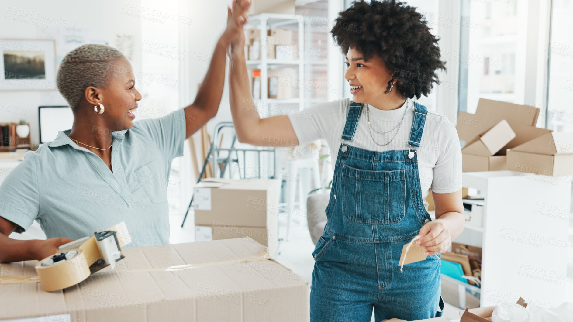 Buy stock photo High five, boxes or business owner in celebration of success, goal or ecommerce sales target in office. Teamwork, proud women or happy fashion designer in collaboration with an excited black woman