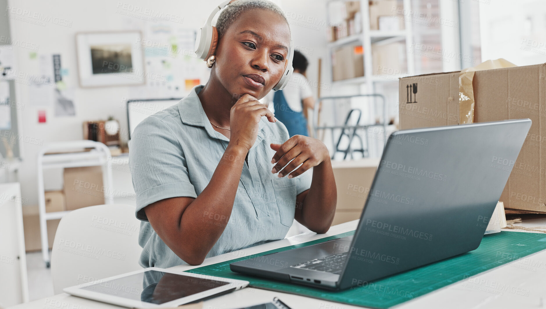 Buy stock photo Woman, laptop and boxes with headphones, reading and logistics for thinking, sales report and e commerce. Entrepreneur, computer and planning schedule for delivery, analytics or supply chain on web