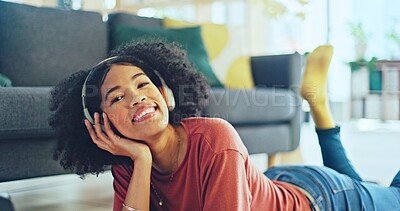 Music, laptop and relax girl on floor carpet streaming radio rap, disco or rock song while singing trendy audio. Headphones, energy or student black woman listening to wellness sound and typing on pc