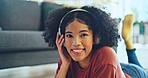 Music, laptop and relax girl on floor carpet streaming radio rap, disco or rock song while singing trendy audio. Headphones, energy or student black woman listening to wellness sound and typing on pc