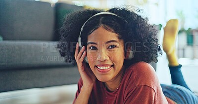 Music, laptop and relax girl on floor carpet streaming radio rap, disco or rock song while singing trendy audio. Headphones, energy or student black woman listening to wellness sound and typing on pc