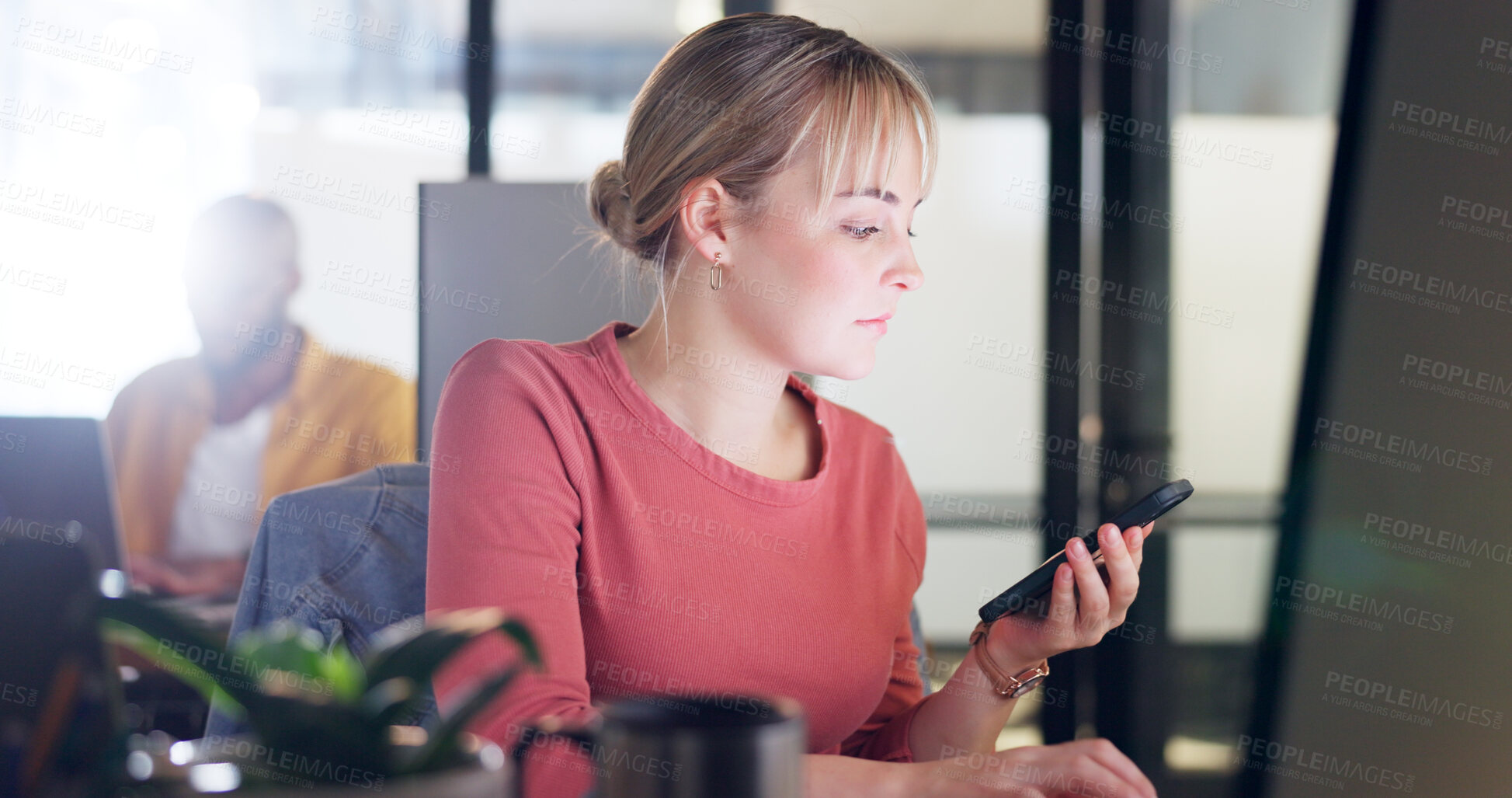 Buy stock photo Phone, communication and a business woman at work on her computer for a schedule update in the office. Contact, search and a young employee networking in the workplace for mobile lead generation