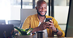 Black man, phone and office chat while online for communication, social media or reading email, news or content creator post. Smile on face of employee at desk for project research on website