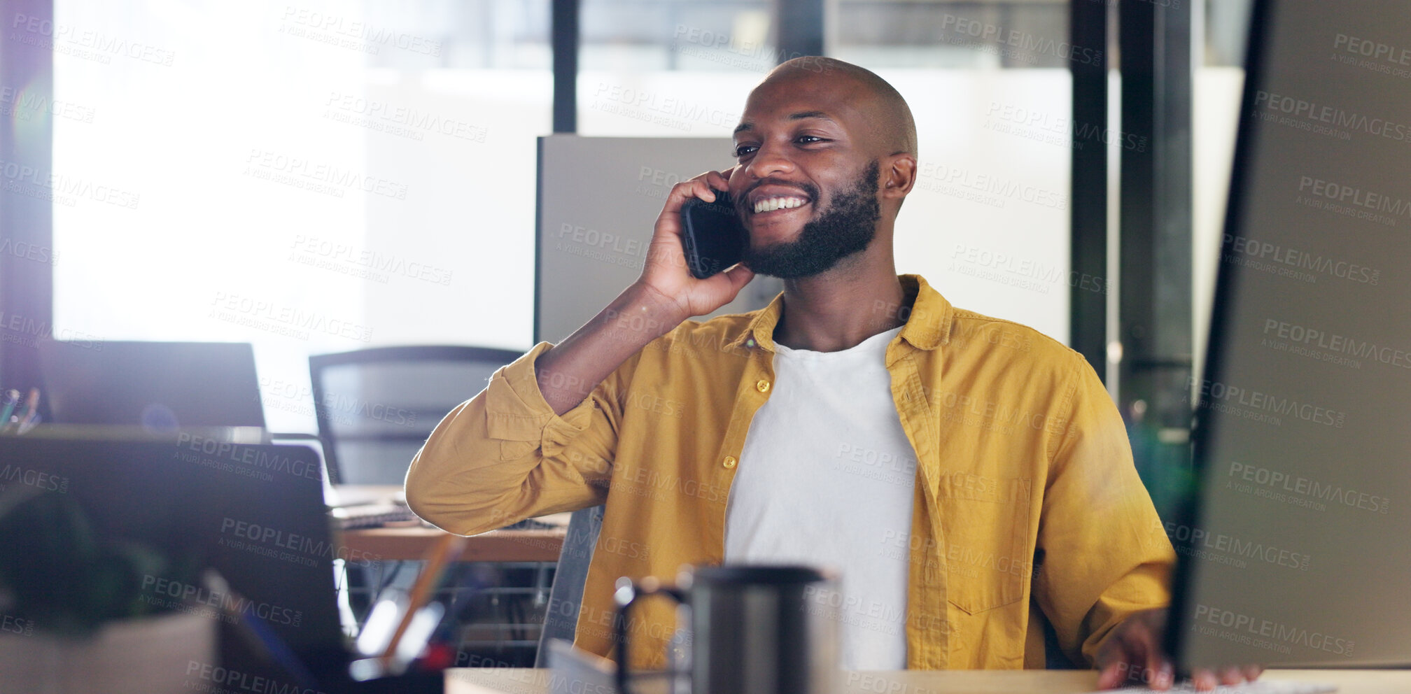 Buy stock photo Phone call, smile and young black man in the office talking for consultation with b2b partner. Happy, startup and African male business entrepreneur on mobile conversation with cellphone in workplace