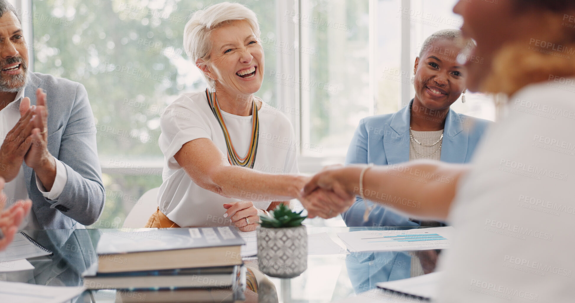 Buy stock photo Handshake, applause and woman in meeting, teamwork or deal in agreement for company goals at office. Happy business people clapping and shaking hands in team support or congratulations at workplace