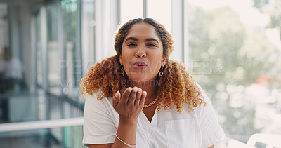 Office, face and happy woman blowing a kiss while working on a creative, marketing or advertising project. Creativity, happiness and professional female employee from Mexico flirting in her workplace