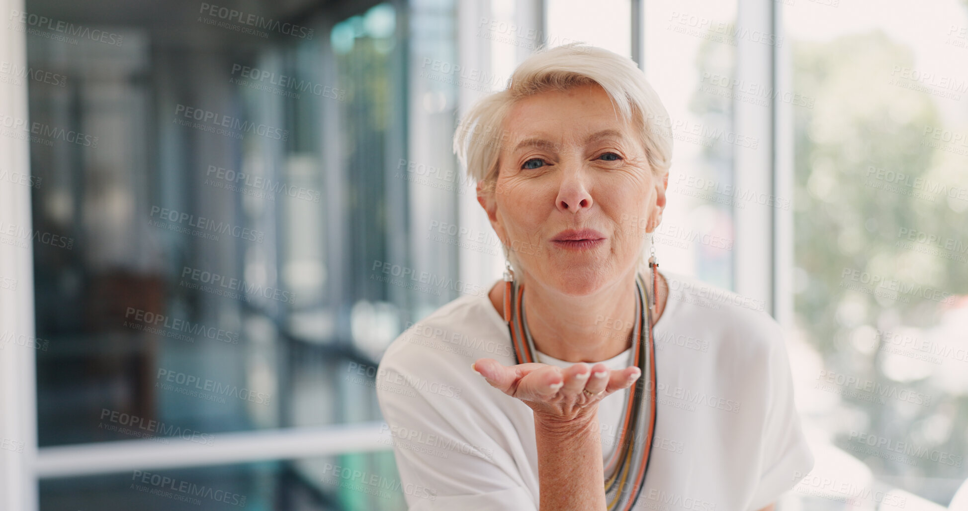 Buy stock photo Portrait, blowing kiss and senior woman in office with thank you, sign or care on blurred background. Face, emoji and lady executive with hand kiss for gratitude of small business, startup or support