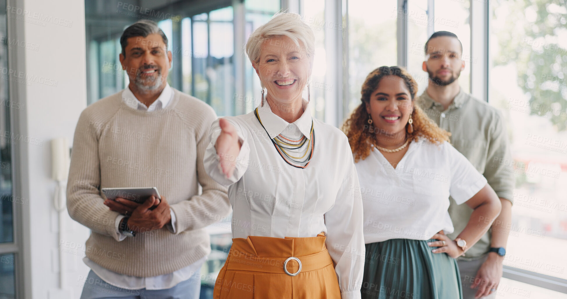 Buy stock photo Business woman, group and handshake for welcome, networking or recruitment drive in office. Human resource agent, team and mature ceo for onboarding, hiring or open palm for shaking hands in portrait