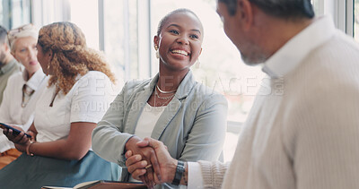 Handshake, hiring or people networking in waiting room before a recruitment job interview in an advertising agency. Partnership, relaxing or happy employees shaking hands, meeting or greeting in line