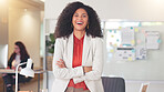 Portrait of a black business woman smiling and laughing while working in an office. Confident HR manager and cheerful african entrepreneur with curly hair feeling motivated and ambitious for success