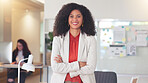 Confident human resources manager looking motivated and ambitious for success. Portrait of a black business woman standing arms crossed, smiling and feeling positive while working in an office