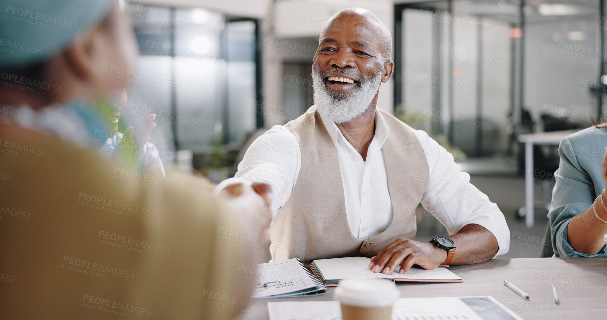 Buy stock photo Handshake, negotiation talk or happy businessman in meeting in office for paperwork or contract. Job interview, shaking hands or senior black man with human resources team for recruitment opportunity