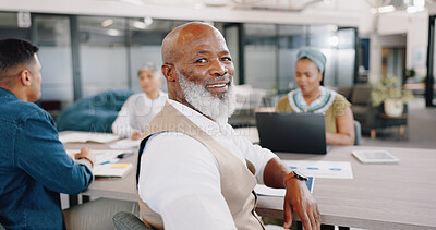 Senior black man, face and corporate meeting in office with team, face and documents for data analysis. Elderly african businessman, happy or portrait by desk at business meeting for financial budget