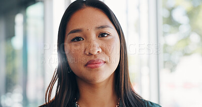 Face, vision and mindset with a business asian woman in her office, standing by a window with flare. Portrait, confidence and mission with a female employee at work with her focus on the future