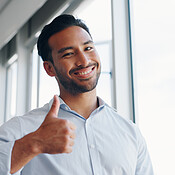 Businessman, thumbs up and wink while walking in office for success ...