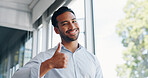 Businessman, thumbs up and wink while walking in office for success, motivation or thank you. Face portrait, yes and male employee from Singapore with hand gesture for support, like emoji or approval