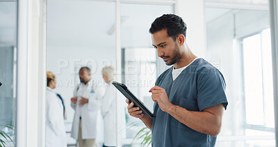 Doctor, tablet and research or planning schedule for healthcare, online medical consultation or search website. Asian man, nurse and reading report or patient analysis on tech device in hospital