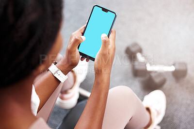 Buy stock photo Fitness, smartphone in hands and mockup with green screen, black woman and app for exercise and weightlifting with dumbbell in gym. Sports marketing, wellness and phone with virtual workout class. 