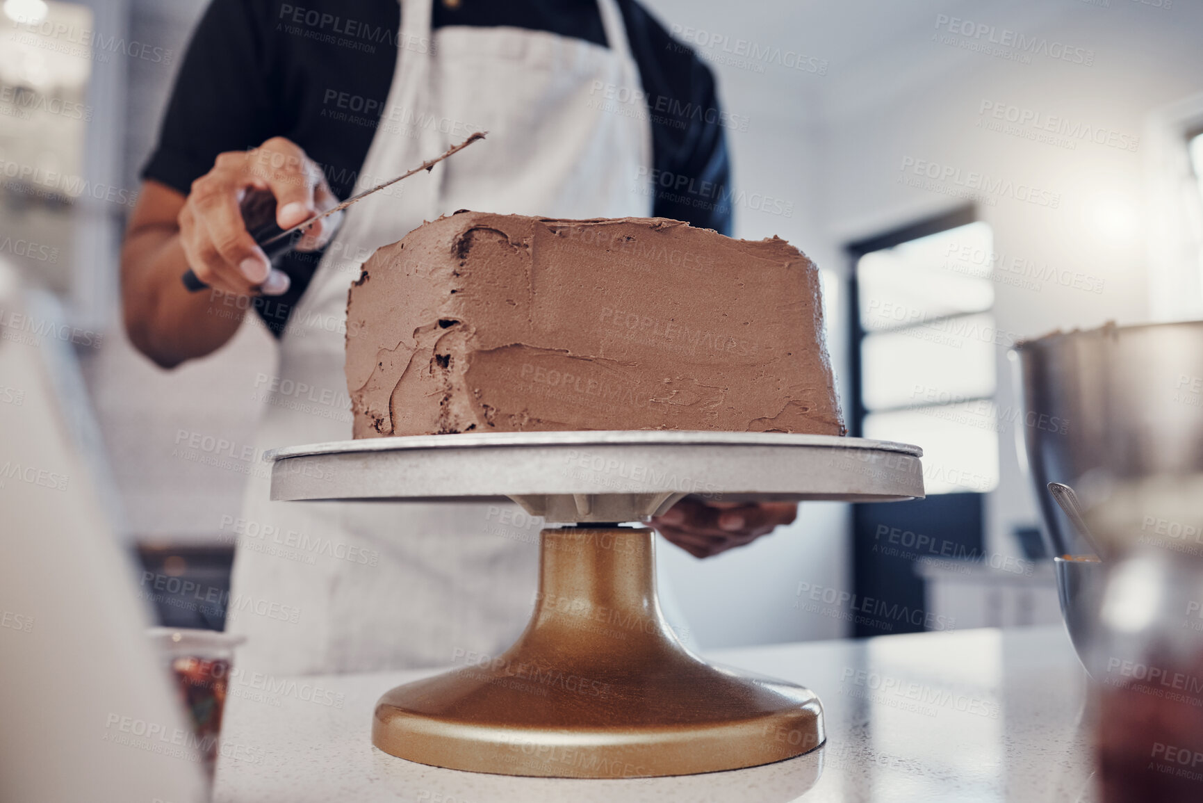 Buy stock photo Frosting, baking and man with a cake in the kitchen for birthday food, dessert and pudding. Cooking, preparation and baker learning to decorate a sweet treat for a celebration on a table in a house