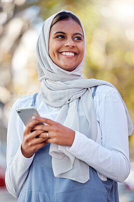 Buy stock photo Hijab, phone and thinking of a girl teenager happy outdoor with mobile connection and networking. Islam, muslim and young person ready for social media network scroll with technology and happiness