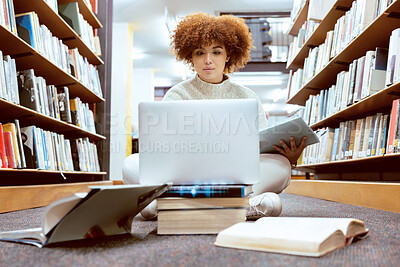 Buy stock photo College library learning, laptop and black woman student working on the floor with books. Reading, computer research and online study of a person with test and exam information for university