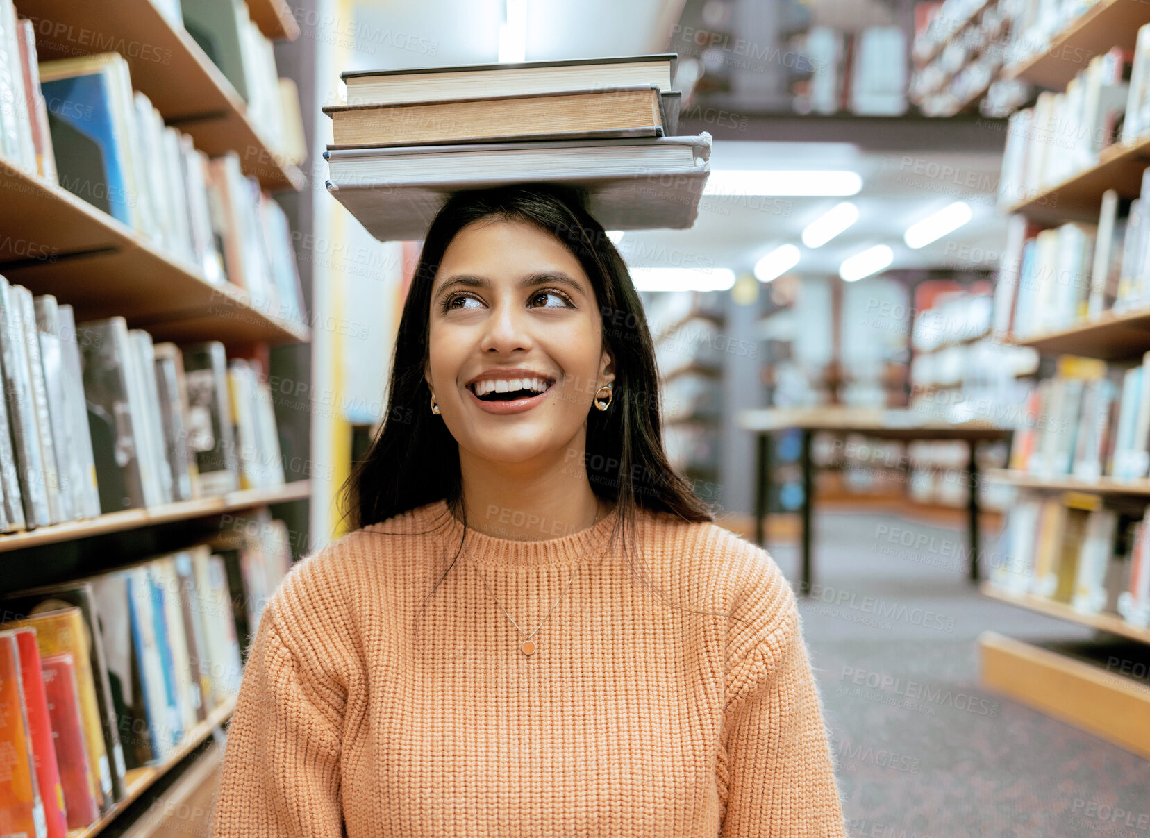Buy stock photo Books, balance or happy student in a library reading for knowledge or development for future growth. Scholarship, portrait or funny school girl smile while studying or learning college information 