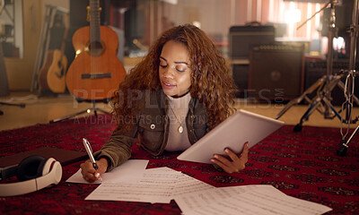 Buy stock photo Musician, studio and woman writing lyrics for a song with paper and a digital tablet for composition. Creative, composer and female musical artist from Mexico working on a album, sound track or sound