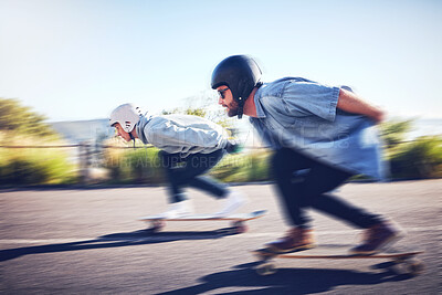Sports, speed and blur, longboard race in road with couple racing downhill on skateboard with helmet safety. Extreme sport adventure, friends skateboarding in street and skateboarder on mountain pass